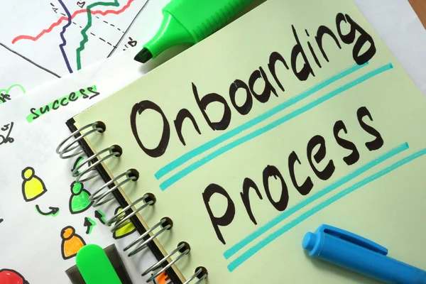 onboarding process written on a notebook